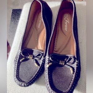 Brown comfy flats with silver tassels, size 7.5